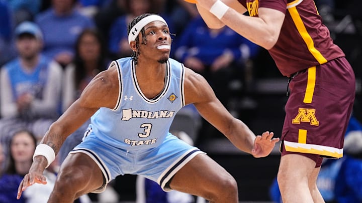 Indiana State Sycamores guard Ryan Conwell (3) guards Minnesota Golden Gophers guard Mike Mitchell