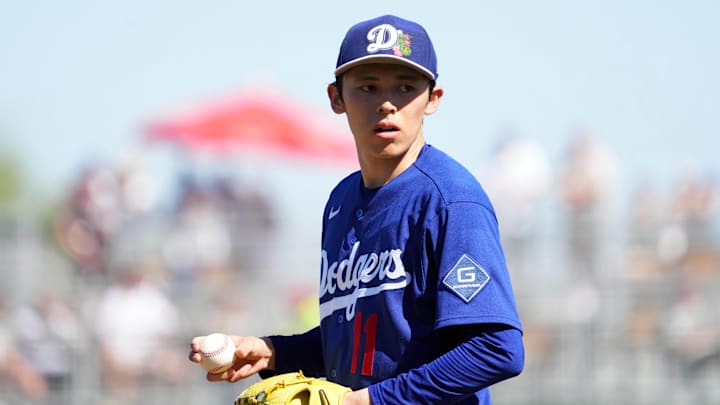 Mar 3, 2026; Goodyear, Arizona, USA; Los Angeles Dodgers starting pitcher Roki Sasaki (11) pitches against the Cleveland Guardians during the third inning at Goodyear Ballpark. Mandatory Credit: Joe Camporeale-Imagn Images