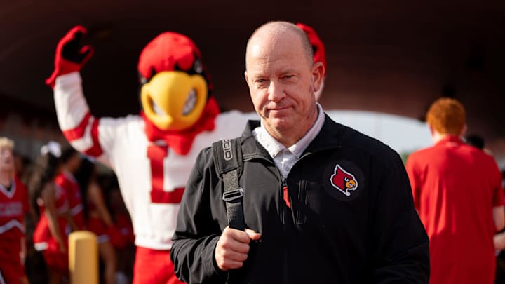 Louisville Cardinals head coach Jeff Brohm walks through the card march ahead of their game on Saturday, Aug. 31, 2024 at L&N Federal Credit Union Stadium in Louisville, Ky.