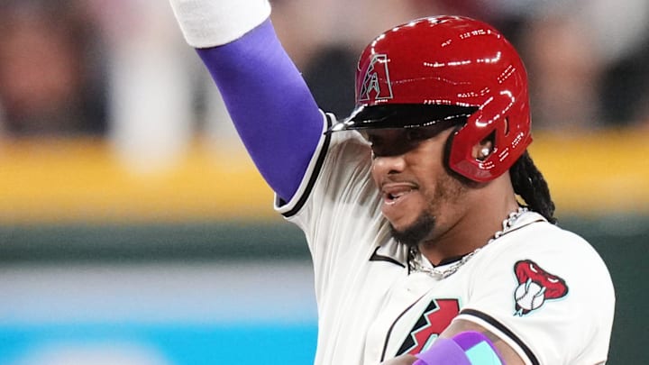 Arizona Diamondbacks' Ketel Marte (4) signals to his teammates after his double during their Opening Day game against the Chicago Cubs at Chase Field in Phoenix on March 27, 2025.