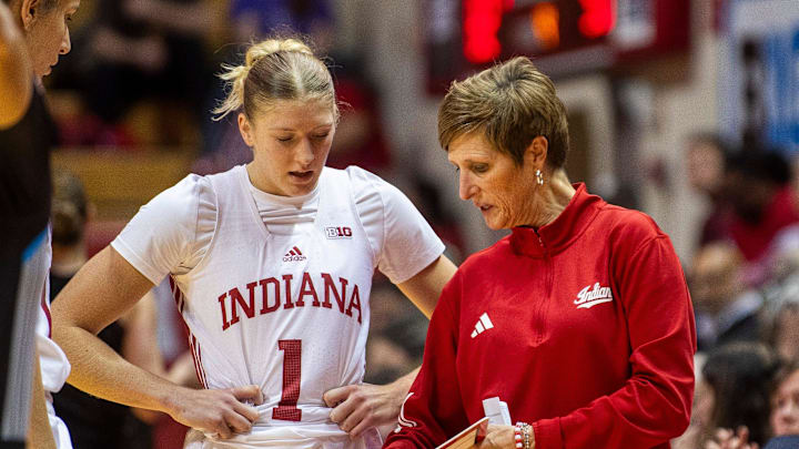 Indiana Head Coach Teri Moren talks with Lexus Bargesser (1) during the Indiana versus Bellarmine women's basketball game at Simon Skjodt Assembly Hall on Sunday, Dec. 15, 2024.