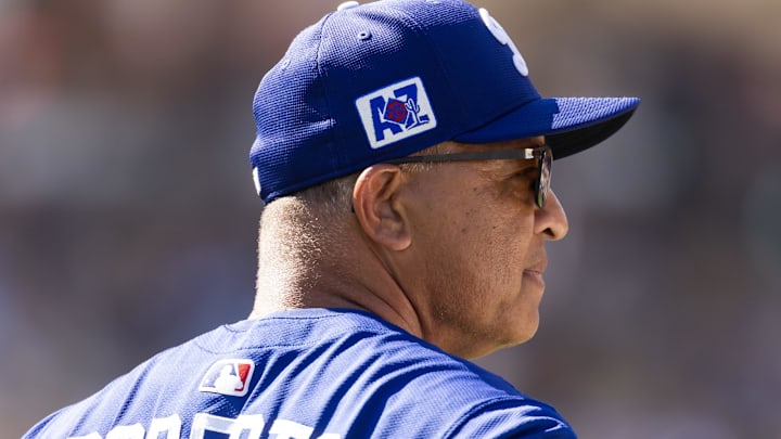 Feb 20, 2025; Phoenix, Arizona, USA; Los Angeles Dodgers manager Dave Roberts against the Chicago Cubs during a spring training game at Camelback Ranch-Glendale. Mandatory Credit: Mark J. Rebilas-Imagn Images