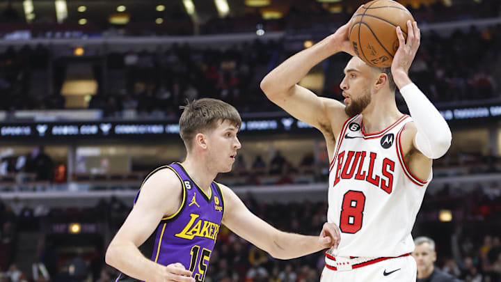 Mar 29, 2023; Chicago, Illinois, USA; Chicago Bulls guard Zach LaVine (8) looks to pass the ball against Los Angeles Lakers guard Austin Reaves (15) during the first half at United Center. Mandatory Credit: Kamil Krzaczynski-Imagn Images Mar 29, 2023; Chicago, Illinois, USA; Chicago Bulls guard Zach LaVine (8) looks to pass the ball against Los Angeles Lakers guard Austin Reaves (15) during the first half at United Center. Mandatory Credit: Kamil Krzaczynski-Imagn Images
