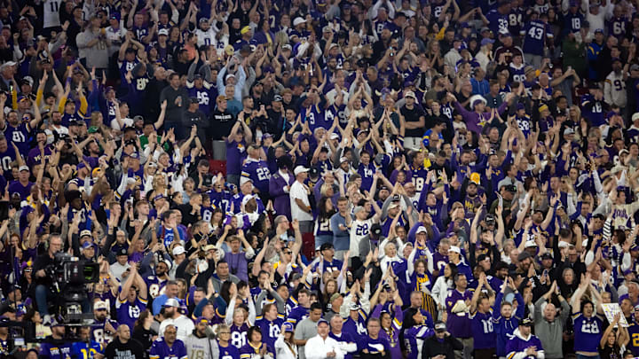 Jan 13, 2025; Glendale, AZ, USA; Minnesota Vikings fans in the crowd cheer against the Los Angeles Rams during an NFC wild card game at State Farm Stadium. Mandatory Credit: Mark J. Rebilas-Imagn Images Jan 13, 2025; Glendale, AZ, USA; Minnesota Vikings fans in the crowd cheer against the Los Angeles Rams during an NFC wild card game at State Farm Stadium. Mandatory Credit: Mark J. Rebilas-Imagn Images