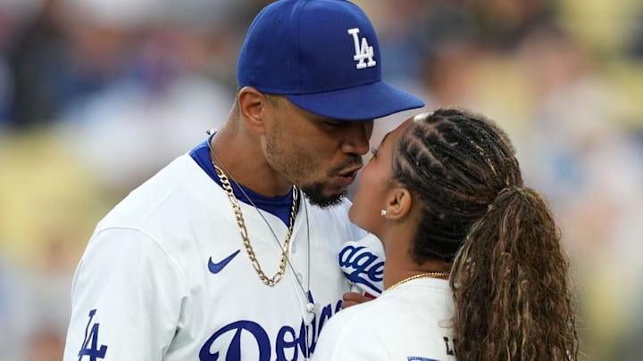 May 21, 2024; Los Angeles, California, USA; Los Angeles Dodgers shortstop Mookie Betts (50) kisses wife Brianna Hammonds before the game against the Arizona Diamondbacks at Dodger Stadium.
