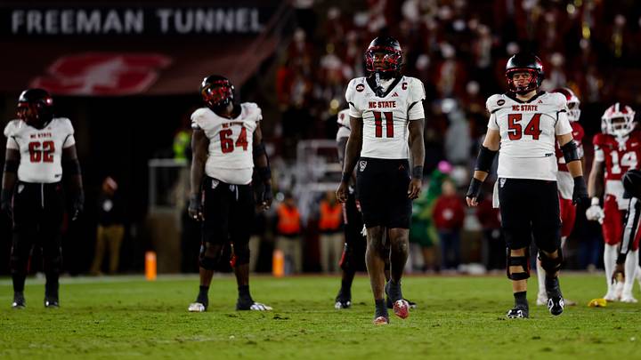 Oct 23, 2026; Stanford, California, USA; NC State Wolfpack quarterback CJ Bailey (11) walks back after a penalty during the third quarter against the Stanford Cardinal at Stanford Stadium. Mandatory Credit: Sergio Estrada-Imagn Images Oct 23, 2026; Stanford, California, USA; NC State Wolfpack quarterback CJ Bailey (11) walks back after a penalty during the third quarter against the Stanford Cardinal at Stanford Stadium. Mandatory Credit: Sergio Estrada-Imagn Images