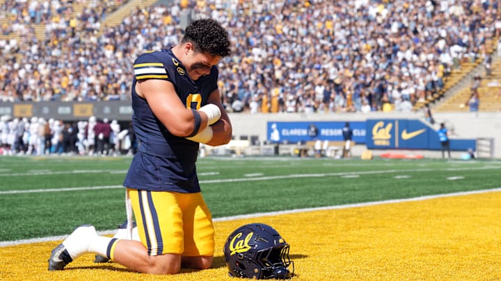 Sep 6, 2025; Berkeley, California, USA; California Golden Bears linebacker Cade Uluave (0) kneels on the field before the game against the Texas Southern Tigers at California Memorial Stadium. Mandatory Credit: Darren Yamashita-Imagn Images Sep 6, 2025; Berkeley, California, USA; California Golden Bears linebacker Cade Uluave (0) kneels on the field before the game against the Texas Southern Tigers at California Memorial Stadium. Mandatory Credit: Darren Yamashita-Imagn Images