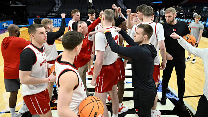 Mar 18, 2026; Portland, OR, USA; Wisconsin Badgers team gathers at midcourt during a practice session ahead of the first round of the men's 2026 NCAA Tournament at Moda Center. Mar 18, 2026; Portland, OR, USA; Wisconsin Badgers team gathers at midcourt during a practice session ahead of the first round of the men's 2026 NCAA Tournament at Moda Center.