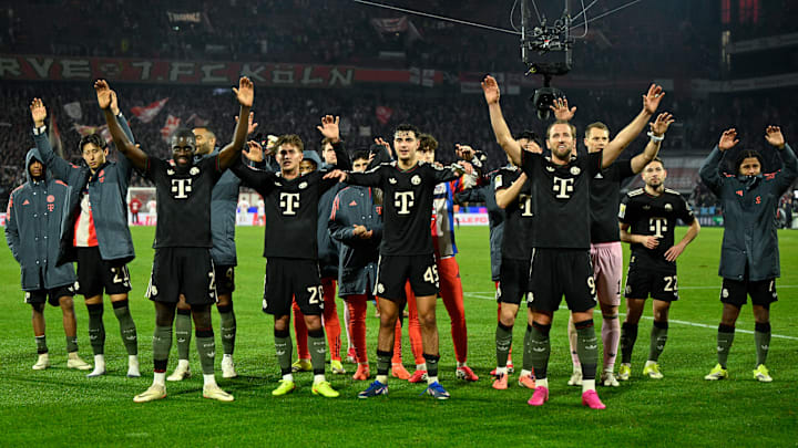 Bayern Munich players celebrating with fans after 3-1 win against FC Koln.