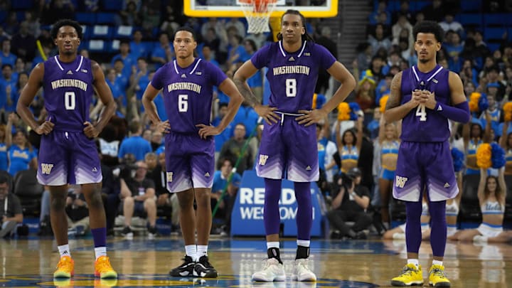 Huskies guard Mekhi Mason (0), guard Tyree Ihenacho (6), guard Tyler Harris (8) and guard DJ Davis (4) during break in the action. Huskies guard Mekhi Mason (0), guard Tyree Ihenacho (6), guard Tyler Harris (8) and guard DJ Davis (4) during break in the action.