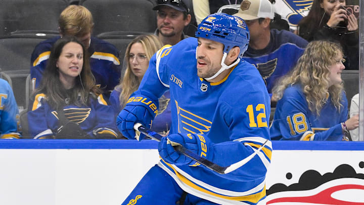 Oct 2, 2025; St. Louis, Missouri, USA; St. Louis Blues left wing Milan Lucic (12) skates against the Ottawa Senators during the second period at Enterprise Center. Mandatory Credit: Jeff Curry-Imagn Images