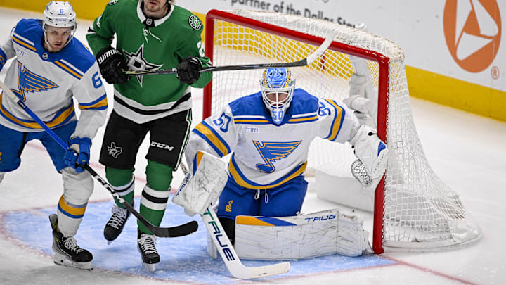 Feb 4, 2026; Dallas, Texas, USA; Dallas Stars center Roope Hintz (24) skates between St. Louis Blues defenseman Philip Broberg (6) and goaltender Jordan Binnington (50) during the second period at the American Airlines Center. Mandatory Credit: Jerome Miron-Imagn Images