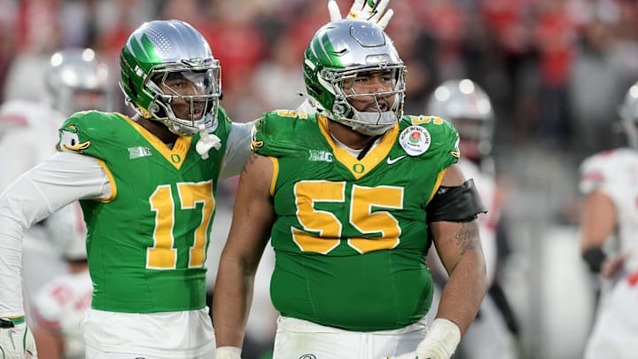 Jan 1, 2025; Pasadena, CA, USA; Oregon Ducks defensive lineman Derrick Harmon (55) reacts in the second half against the Ohio State Buckeyes in the 2025 Rose Bowl college football quarterfinal game at Rose Bowl Stadium. Mandatory Credit: Kirby Lee-Imagn Images Jan 1, 2025; Pasadena, CA, USA; Oregon Ducks defensive lineman Derrick Harmon (55) reacts in the second half against the Ohio State Buckeyes in the 2025 Rose Bowl college football quarterfinal game at Rose Bowl Stadium. Mandatory Credit: Kirby Lee-Imagn Images