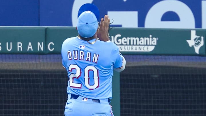 Texas Rangers third baseman Ezequiel Duran (20) makes a catch during the ninth inning against the Boston Red Sox at Globe Life Field on March 30.