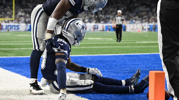Dallas Cowboys receiver CeeDee Lamb is helped by running back Javonte Williams after being injured against the Detroit Lions 