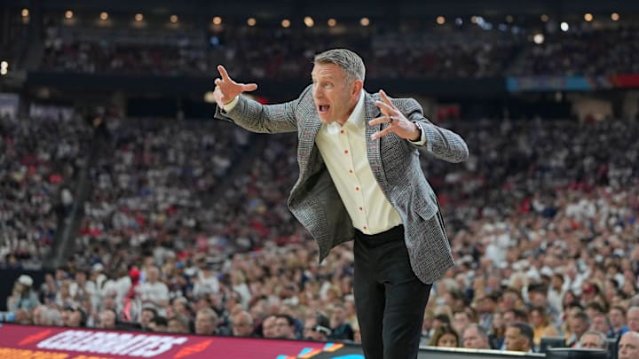 Apr 6, 2024; Glendale, AZ, USA; Alabama Crimson Tide head coach Nate Oats players against the Connecticut Huskies during the first half in the semifinals of the men's Final Four of the 2024 NCAA Tournament at State Farm Stadium. Mandatory Credit: Bob Donnan-Imagn Images Apr 6, 2024; Glendale, AZ, USA; Alabama Crimson Tide head coach Nate Oats players against the Connecticut Huskies during the first half in the semifinals of the men's Final Four of the 2024 NCAA Tournament at State Farm Stadium. Mandatory Credit: Bob Donnan-Imagn Images