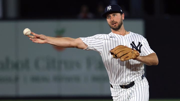 Feb 25, 2026; Tampa, Florida, USA; New York Yankees infielder Paul DeJong (18) throws the ball to first base for an out during the first inning against the Washington Nationals at George M. Steinbrenner Field. Mandatory Credit: Kim Klement Neitzel-Imagn Images