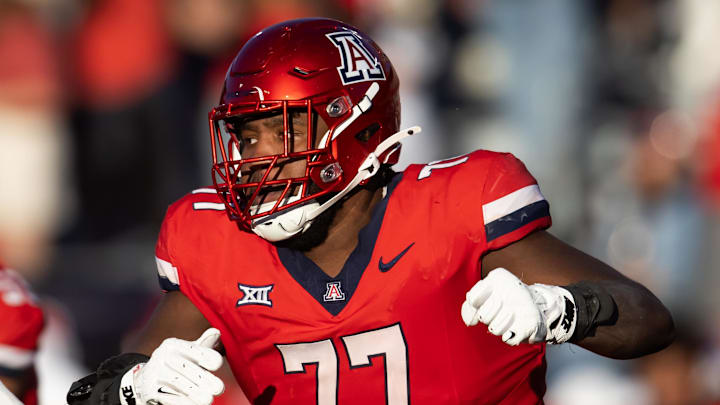 Nov 30, 2024; Tucson, Arizona, USA; Arizona Wildcats offensive lineman Michael Wooten (77) against the Arizona State Sun Devils during the Territorial Cup at Arizona Stadium. Mandatory Credit: Mark J. Rebilas-Imagn Images