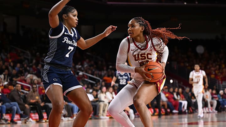 Jan 12, 2025; Los Angeles, California, USA; USC Trojans forward Kiki Iriafen (44) drives to the basket as Penn State Nittany Lions forward Grace Hall (7) moves in to defend during the fourth quarter at Galen Center. Mandatory Credit: Robert Hanashiro-Imagn Images