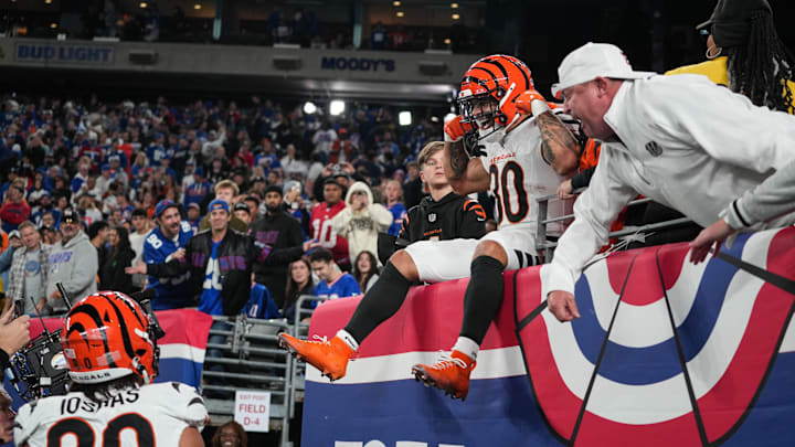 Bengals Chase Brown (30) celebrates with fans after scoring a touchdown during their game against the Giants at MetLife Stadium on Sunday October 13, 2024. Bengals won the game with a final score of 17-7.