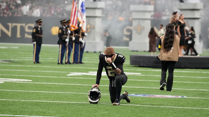 Oct 26, 2025; New Orleans, Louisiana, USA; New Orleans Saints quarterback Spencer Rattler (2) kneels on the field prior to a game against the Tampa Bay Buccaneers at Caesars Superdome. Mandatory Credit: Matthew Hinton-Imagn Images