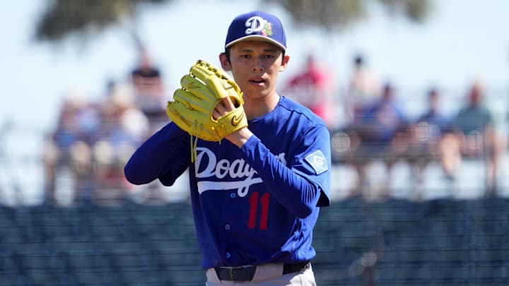 Los Angeles Dodgers starting pitcher Roki Sasaki (11) pitches against the Cleveland Guardians.