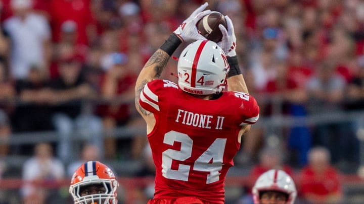 Nebraska tight end Thomas Fidone II catches a pass that turns into a 17-yard gain against Illinois. Nebraska tight end Thomas Fidone II catches a pass that turns into a 17-yard gain against Illinois.