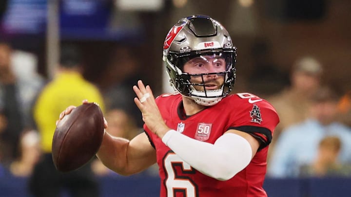 Nov 23, 2025; Inglewood, California, USA; Tampa Bay Buccaneers quarterback Baker Mayfield (6) looks to pass the ball while running outside the pocket against the Los Angeles Rams during the first quarter at SoFi Stadium. Mandatory Credit: Kiyoshi Mio-Imagn Images