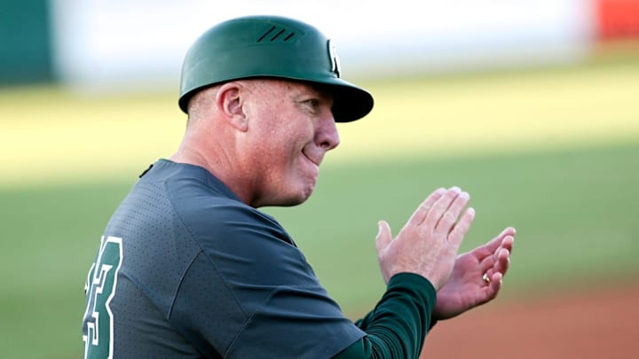 Michigan State's coach Jake Boss Jr. claps in the second inning on Wednesday, April 6, 2022, during the Crosstown Showdown against the Lugnuts at Jackson Field in Lansing.

220406 Lugnuts Msu Bsball 047a