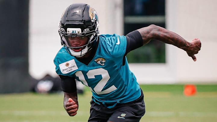 Jacksonville Jaguars wide receiver and cornerback Travis Hunter (12) participates in a drill during rookie minicamp.