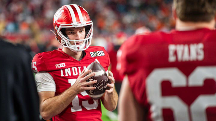 Indiana's Fernando Mendoza (15) gets loose before the College Football Playoff National Championship college football game at Hard Rock Stadium in Miami Gardens on Monday, Jan. 19, 2026.