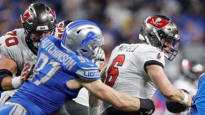 Detroit Lions defensive end Aidan Hutchinson (97) tackles Tampa Bay Buccaneers quarterback Baker Mayfield (6) during the second half of the NFC divisional round at Ford Field in Detroit on Sunday, Jan. 21, 2024. Detroit Lions defensive end Aidan Hutchinson (97) tackles Tampa Bay Buccaneers quarterback Baker Mayfield (6) during the second half of the NFC divisional round at Ford Field in Detroit on Sunday, Jan. 21, 2024.