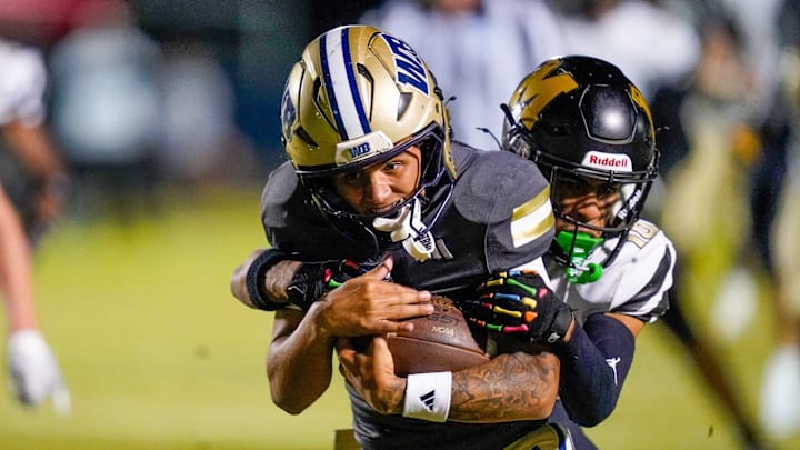 West Boca Raton quarterback Trey Moran (1) rushes for a first-quarter touchdown earlier this season against Mitchell. He has led the Bulls to the Class 6A state title game for the second consecutive year. West Boca Raton will play West Broward for the championship on Friday, Dec. 12, at FIU's Pitbull Stadium in Miami.