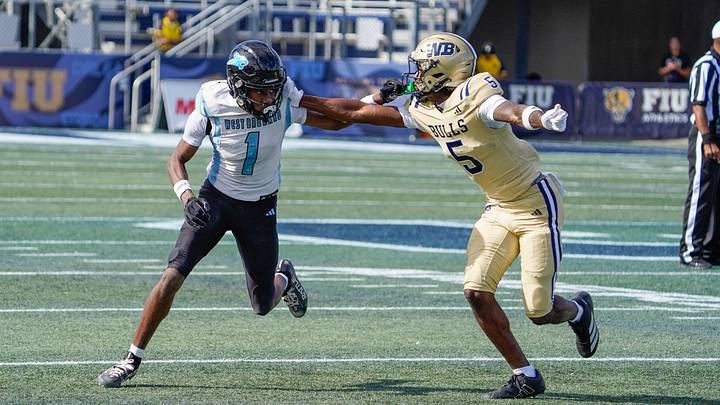 West Broward wide receiver Amir Sears (1) runs a route against West Boca cornerback Jaydin Broadnax (5) in the second quarter of the 6A State Final at Pitbull Stadium on Dec. 12, 2025, in Miami, FL.
