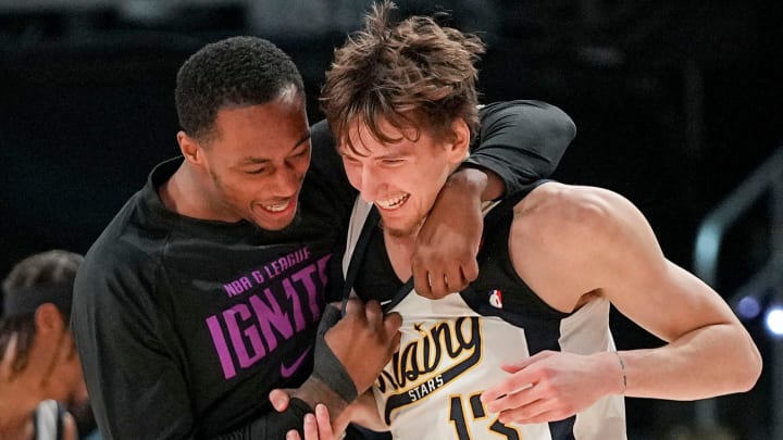 Team Detlef forward Matas Buzelis, right, of the G League Ignite celebrates with a teammate after