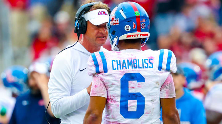 Oct 25, 2025; Norman, Oklahoma, USA;  Ole Miss Rebels head coach Lane Kiffin speaks with Ole Miss Rebels quarterback Trinidad Chambliss (6) during the second half at Gaylord Family-Oklahoma Memorial Stadium. Mandatory Credit: Kevin Jairaj-Imagn Images