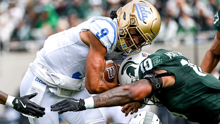 Michigan State's Wayne Matthews III, right, tackles UCLA's Nico Iamaleava during the second quarter on Saturday, Oct. 11, 2025, at Spartan Stadium in East Lansing.