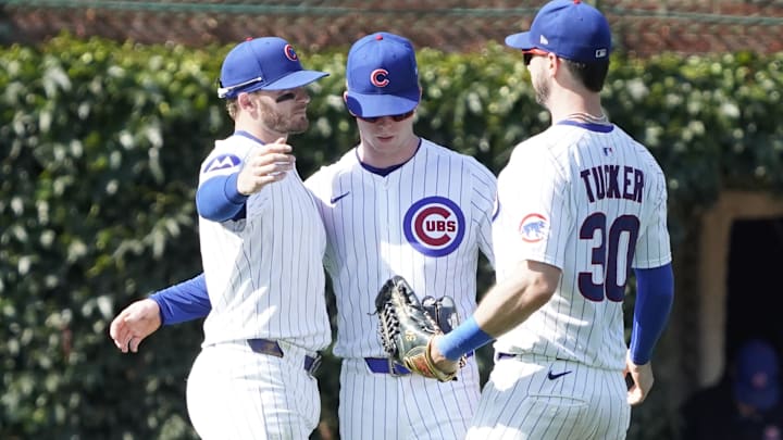 Jun 21, 2025; Chicago, Illinois, USA; L-R Chicago Cubs outfielder Ian Happ (8) outfielder Pete Crow-Armstrong (4) and outfielder Kyle Tucker (30) celebrate their win against the Seattle Mariners  at Wrigley Field. 