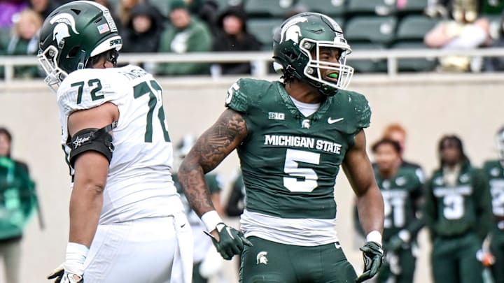 Michigan State's Jordan Hall, right, celebrates after a play during the Spring Showcase on Saturday, April 20, 2024, at Spartan Stadium in East Lansing.