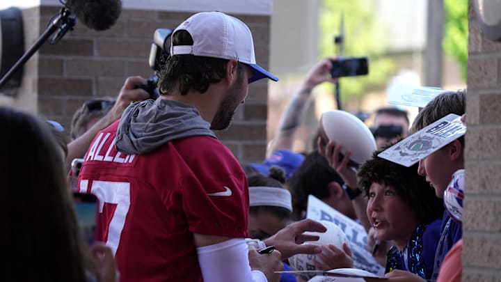 Buffalo Bills quarterback Josh Allen signs autographs as children scream his name at the end of Buffalo Bills training camp at St. John Fisher University in Pittsford on July 23, 2025.