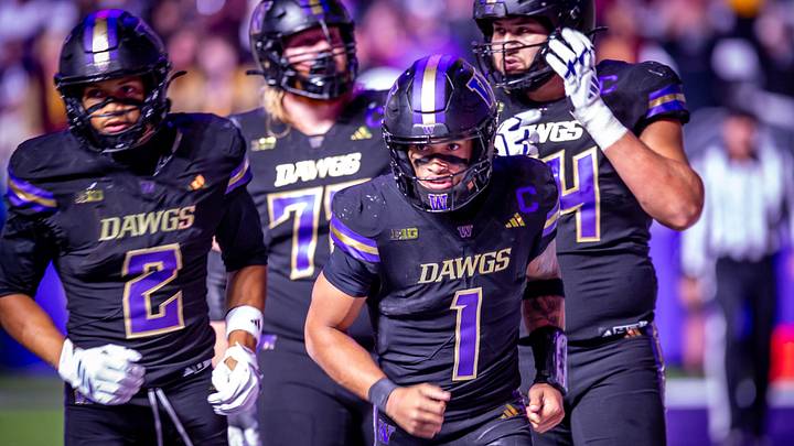 Demond Williams Jr. leads his UW offense onto the field. Demond Williams Jr. leads his UW offense onto the field.