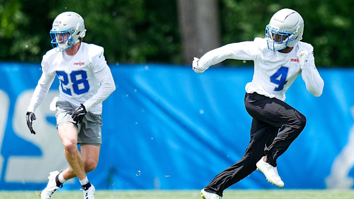 Detroit Lions cornerback D.J. Reed (4), right, and safety Dan Jackson (28) practices during OTA at Meijer Performance Center in Allen Park on Friday, May 30, 2025.