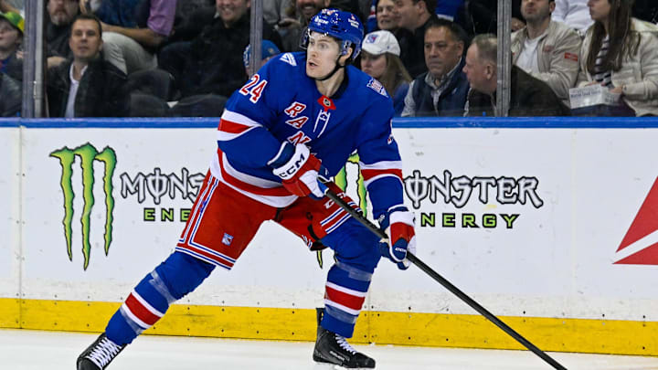 Mar 10, 2026; New York, New York, USA;  New York Rangers left wing Tye Kartye (24) plays the puck against the Calgary Flames during the first period at Madison Square Garden. Mandatory Credit: Dennis Schneidler-Imagn Images