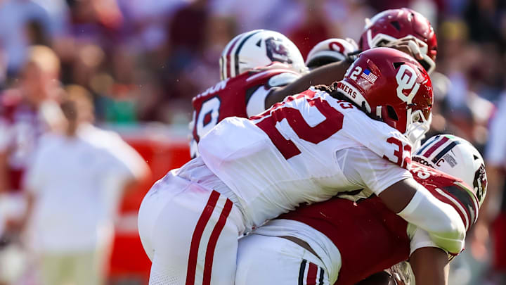 South Carolina Gamecocks quarterback Lanorris Sellers (16) is sacked by Oklahoma Sooners defensive lineman R Mason Thomas (32) in the second half at Williams-Brice Stadium. Thomas could return for OU's College Football Playoff opener against Alabama on Friday.