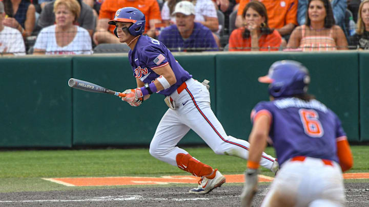 Jun 1, 2024; Clemson, South Carolina, USA; Clemson Tigers outfielder Cam Cannarella (10) drives in a run against the Coastal Carolina Chanticleers during the seventh inning in the Clemson Regional at Doug Kingsmore Stadium.