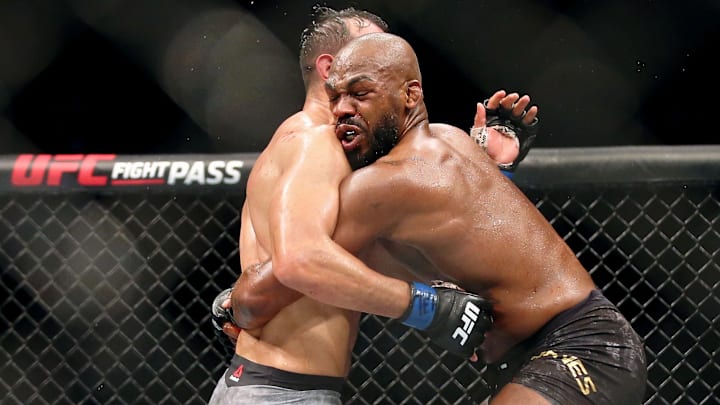 Feb 8, 2020; Houston, Texas, USA; Jon Jones (red gloves) fights Dominick Reyes (blue gloves) during