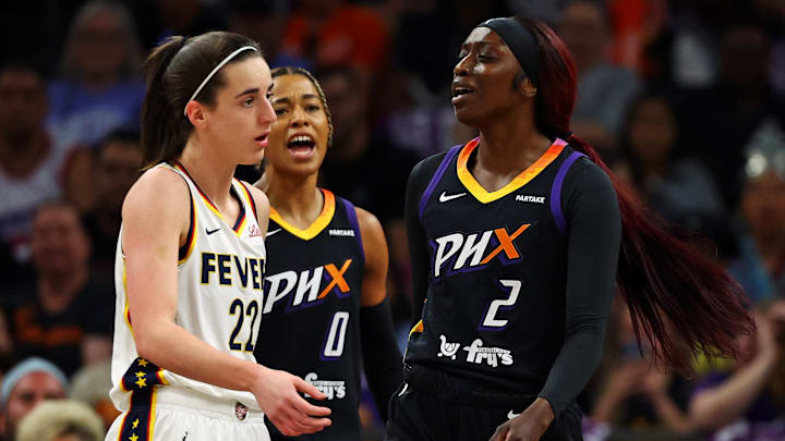 Jun 30, 2024; Phoenix, Arizona, USA; Indiana Fever guard Caitlin Clark (22) reacts to Phoenix Mercury guard Kahleah Copper (2) during the first half at Footprint Center. Mandatory Credit: Mark J. Rebilas-Imagn Images