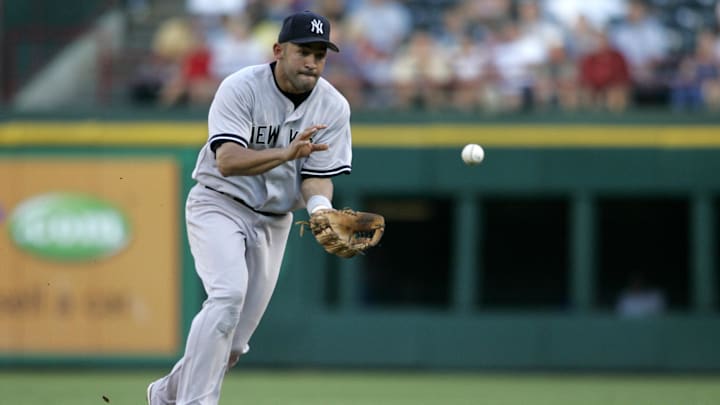 July 25th, 2006  Arlington ,Texas USA; New York Yankees second baseman (14) Miguel Cairo fields a ground ball during the game against the Texas Rangers at Ameriquest Field.  Mandatory Credit: Photo by Tim Heitman-Imagn Images(c) Copyright 2006 Tim Heitman