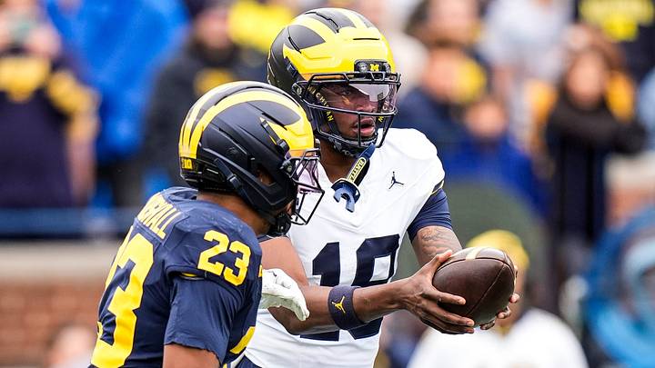 Michigan quarterback Bryce Underwood (19) hands the ball to Team Blue running back Jordan Marshall (23) during the spring game at Michigan Stadium in Ann Arbor on Saturday, April 18, 2026.