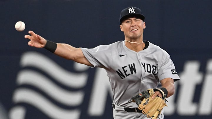 Jul 22, 2025; Toronto, Ontario, CAN;   New York Yankees shortstop Anthony Volpe (11) makes a throwing error against the Toronto Blue Jays in the sixth inning at Rogers Centre. Mandatory Credit: Dan Hamilton-Imagn Images